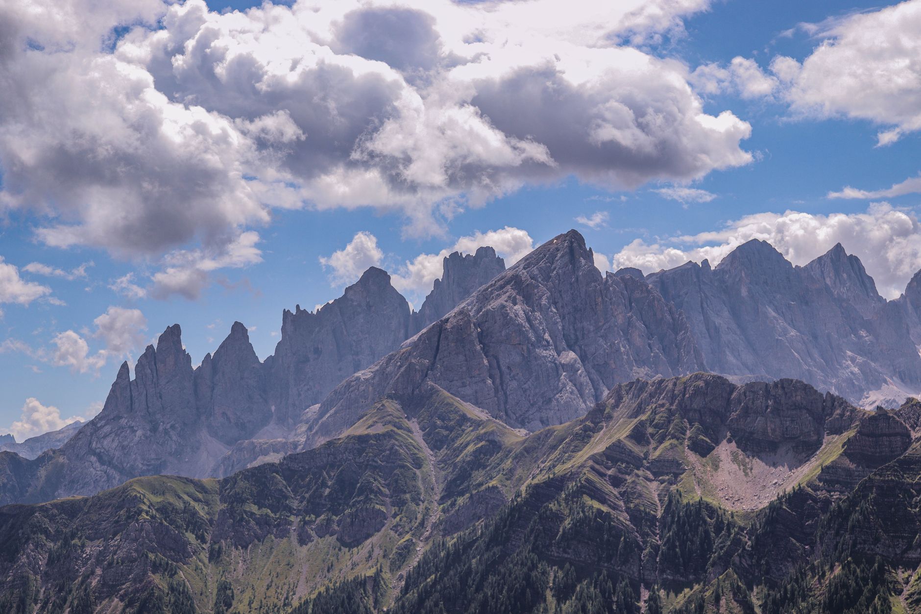 Dramatic alpine peaks under crisp morning blue sky